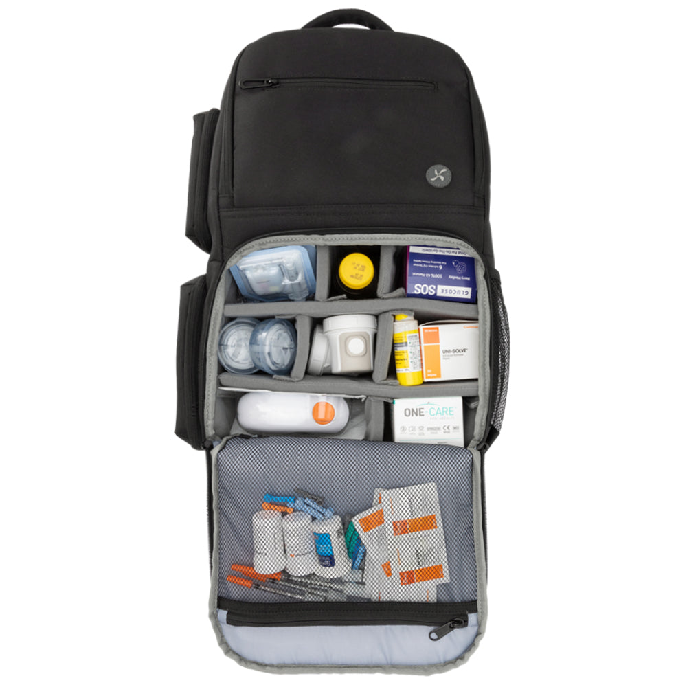 Charcoal grey XL Travel Backpack main pocket open filled with diabetic supplies. 