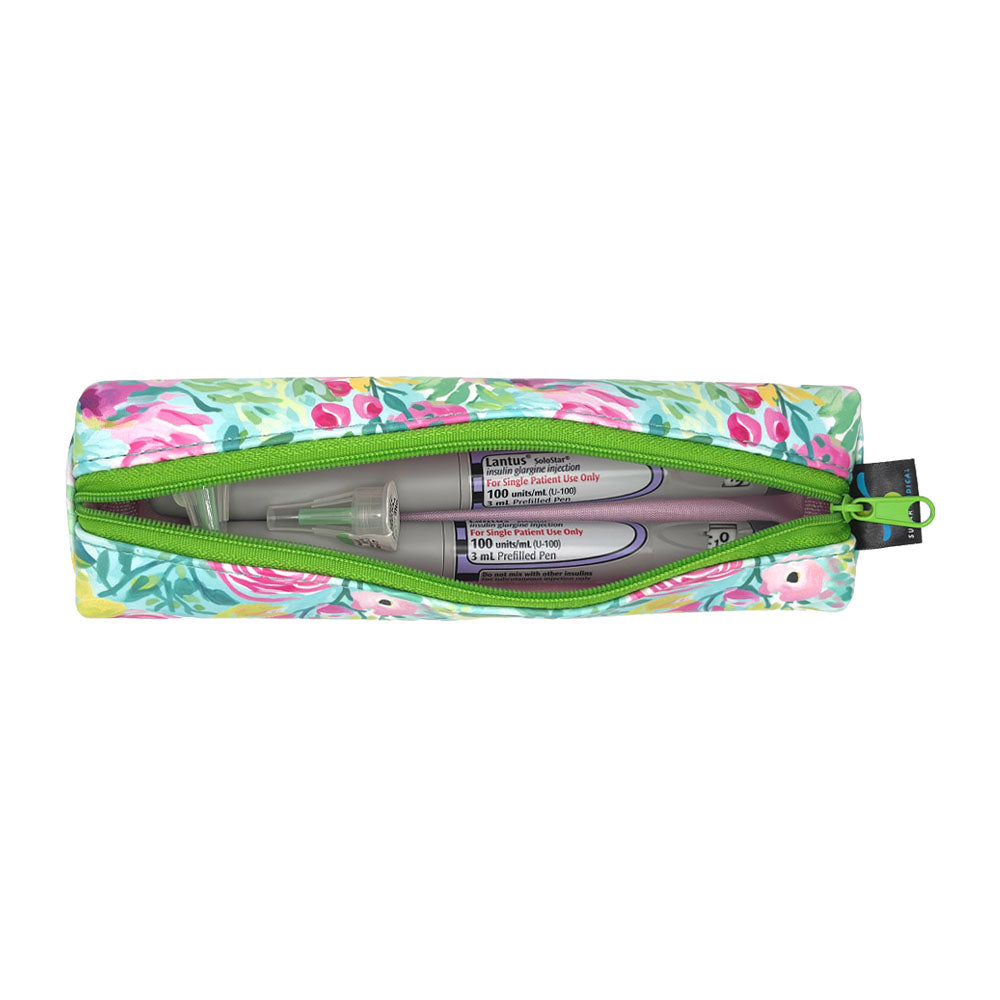 Floral-patterned slim case open with two insulin pens and pen tips in it. 
