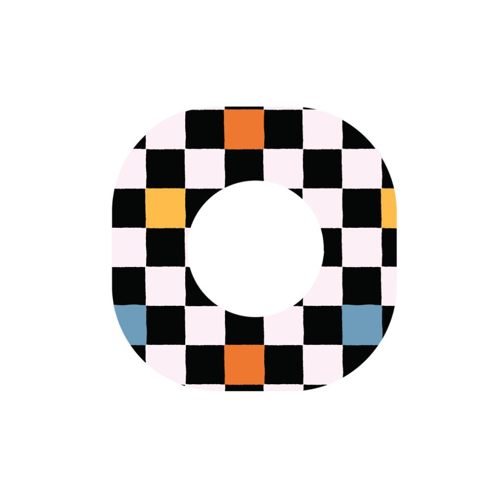 Adhesive tape in a skater grid pattern which is mostly black and white, with a few squares colored in yellow, blue, and orange.