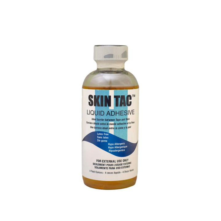 Skin Tac liquid adhesive bottle white background