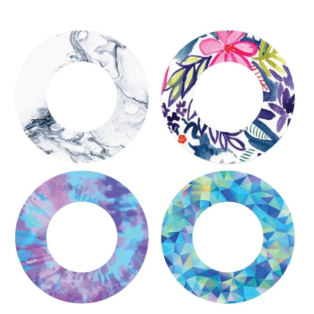 Four different patterns of adhesive tapes in pastel colors designed to custom fit around the Libre Freestyle sensor.