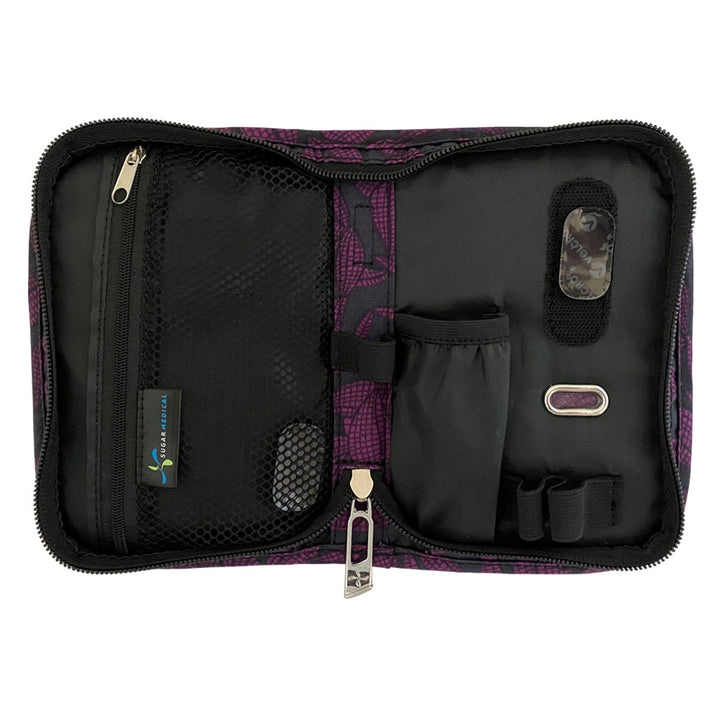 Sugar Medical Diabetes Deluxe Supply Case in black with purple flowers inside with pockets and loops to organize your diabetic supplies. 