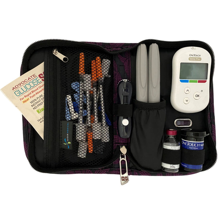 Sugar Medical Diabetes Deluxe Supply Case in black with purple flowers inside set up with glucose meter, test strips, lancet and insulin pens.