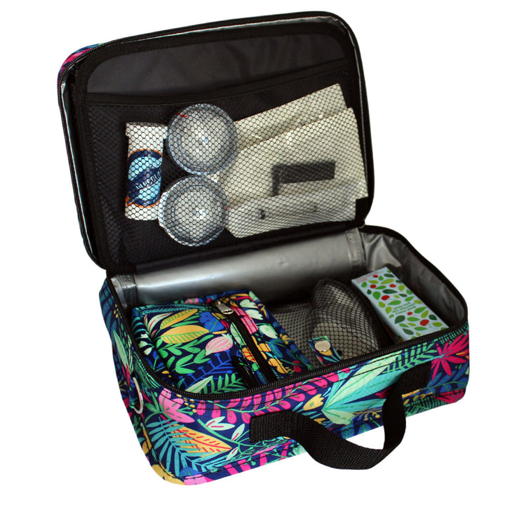 Diabetes Insulated Travel Bag in Blue Floral back compartment for a glucagon kit, Tandem supplies, Dexcom, snacks, glucose tablets, and includes a removable pouch on girl’s lap. 