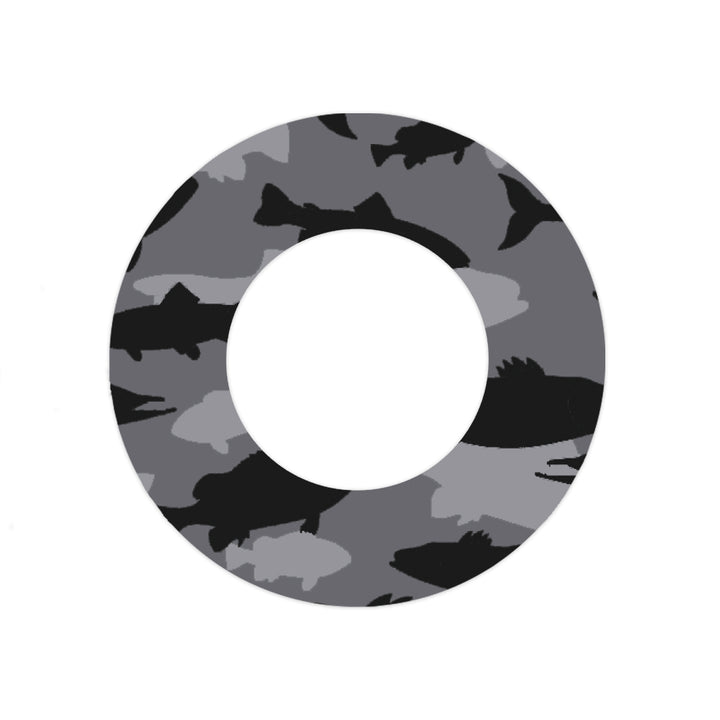 Adhesive tape that has black and grey fish in a camouflage pattern designed to fit around the Libre Freestyle sensor.