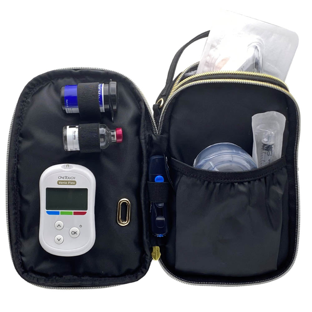 Black diabetes purse with Medtronic insulin pump supplies loaded into center compartment.